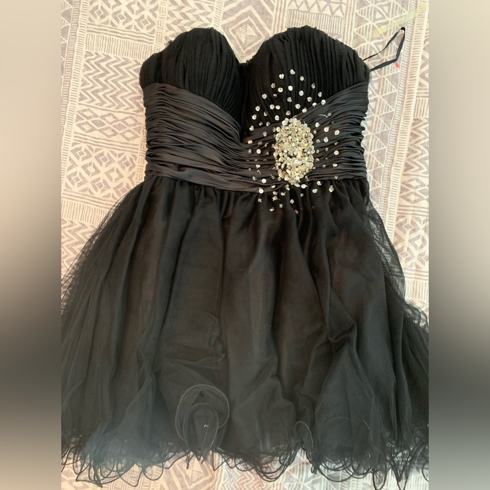 Size 10-12, black with silver design prom dress worn once, short, strapless.